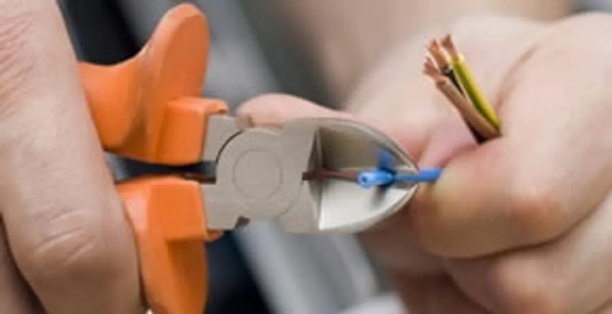 professional electrical services showing precise wire cutting by licensed electricians in Fort Lauderdale, FL
